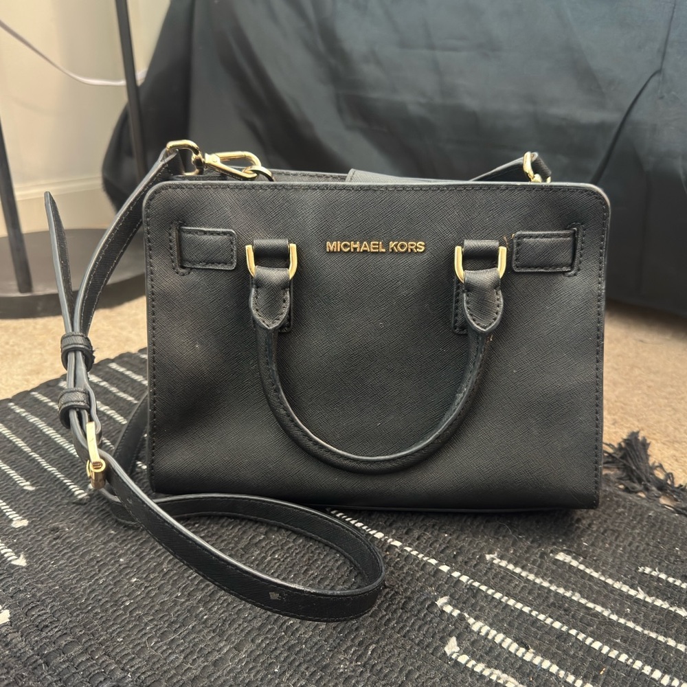 Michael Kors small black purse. Over the shoulder strap and key chain included.